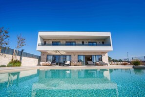 A modern two-story house with a swimming pool in front. - Villa Freedom (Vodice)