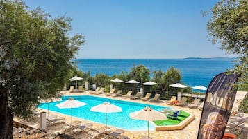 Outdoor pool, open 9:00 AM to 7:00 PM, pool umbrellas, pool loungers