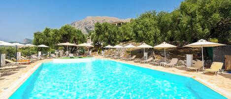 Outdoor pool, open 9:00 AM to 7:00 PM, pool umbrellas, sun loungers