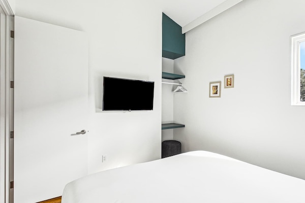 Bedroom 2 has a TV.