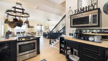 Fridge, dishwasher, coffee/tea maker, cookware/dishes/utensils