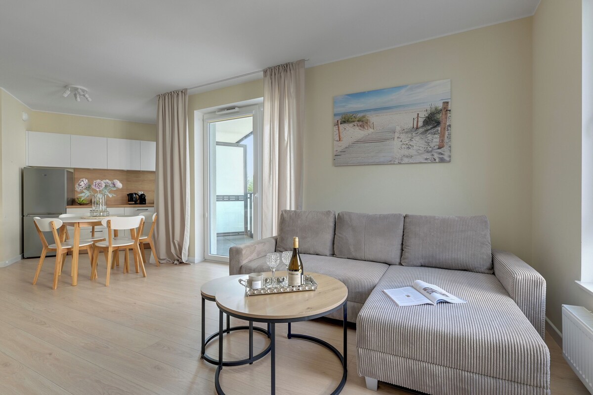 Superior Apartment, 1 Bedroom, Balcony | Living area | 50-inch flat-screen TV with cable channels