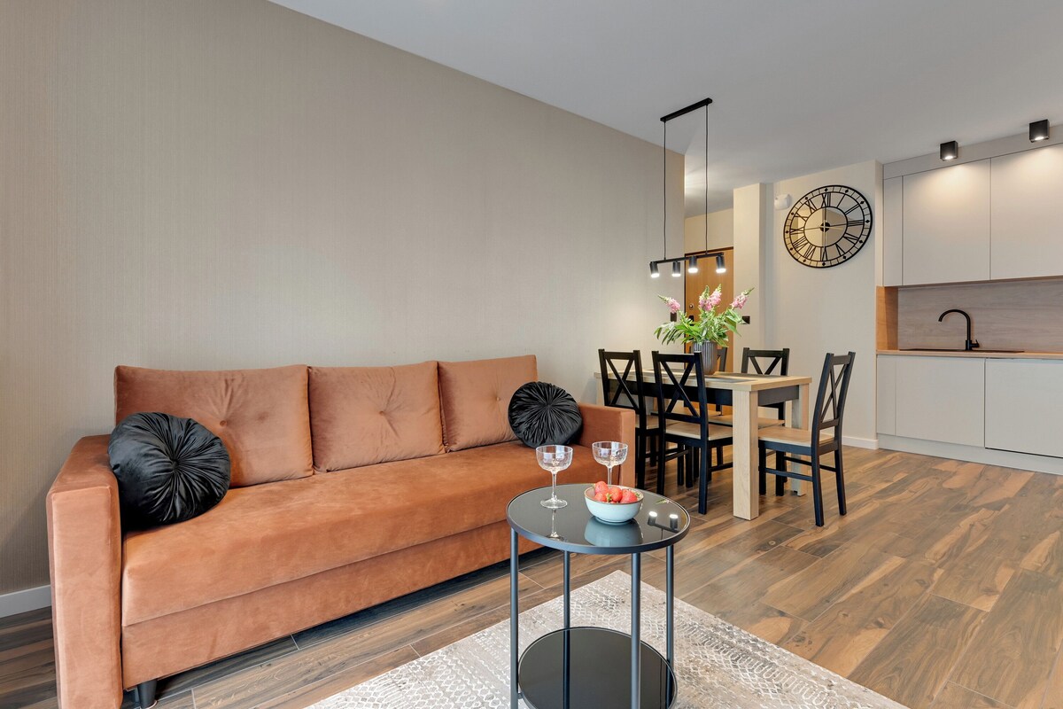 Deluxe Apartment, 2 Bedrooms, Balcony | Living area | 50-inch flat-screen TV with cable channels