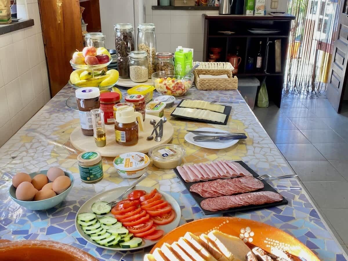 A kitchen counter with various food items and utensils.