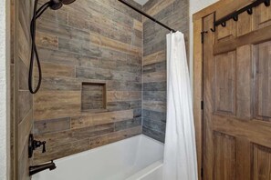 Shower, hair dryer, towels, shampoo