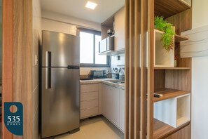 Fridge, microwave, oven, cookware/dishes/utensils