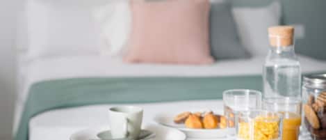 Deluxe Quadruple Room, Private Bathroom, City View | Laptop workspace, blackout curtains, soundproofing, iron/ironing board