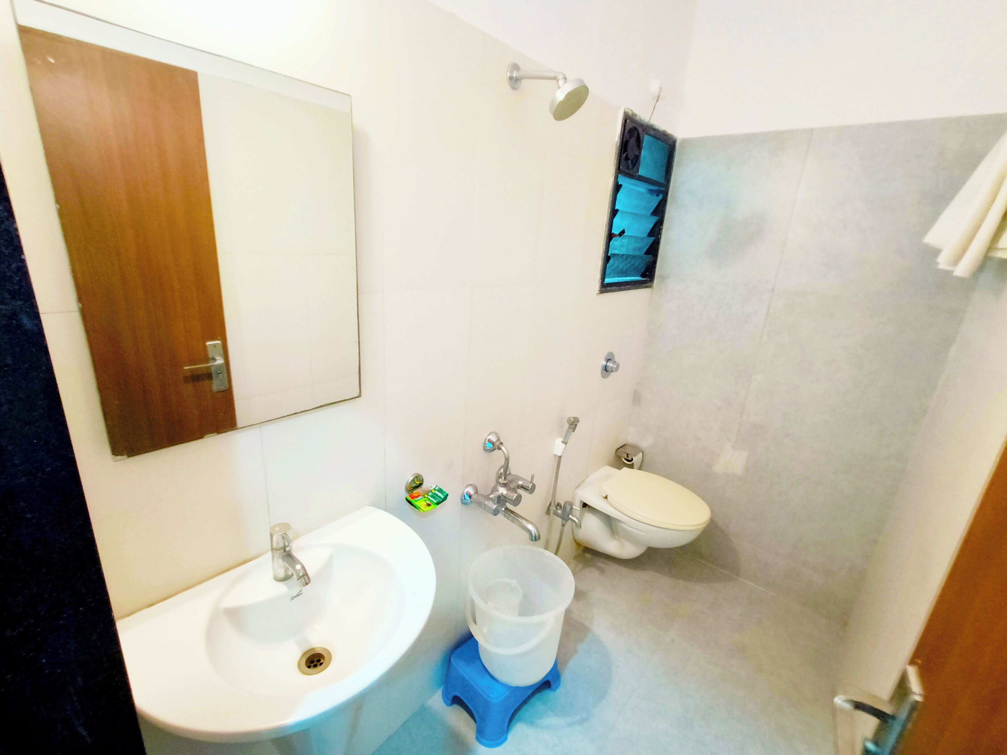 A bathroom with a sink, toilet, and shower.