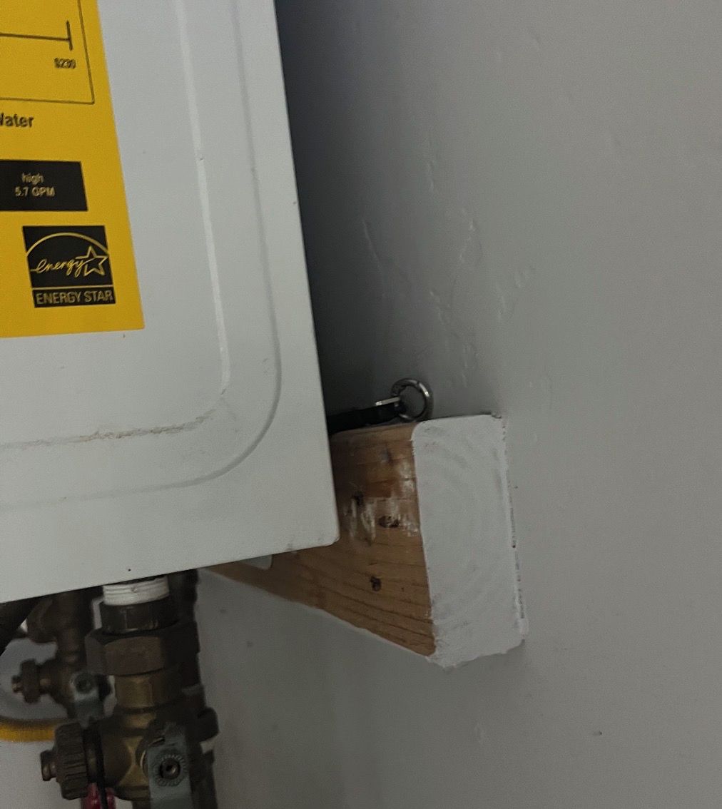 A water heater with a label indicating 'ENERGY STAR' and '5.7 GPM' water flow.