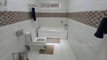Bidet, towels, soap, toilet paper