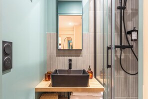 Shower, hair dryer, towels, soap