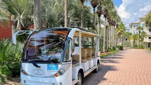 A white bus with the label "Route E" parked on a brick pathway. - Seacrest 4BR on 30A | Walk to Dining, Shops + Beach (Inlet Beach)