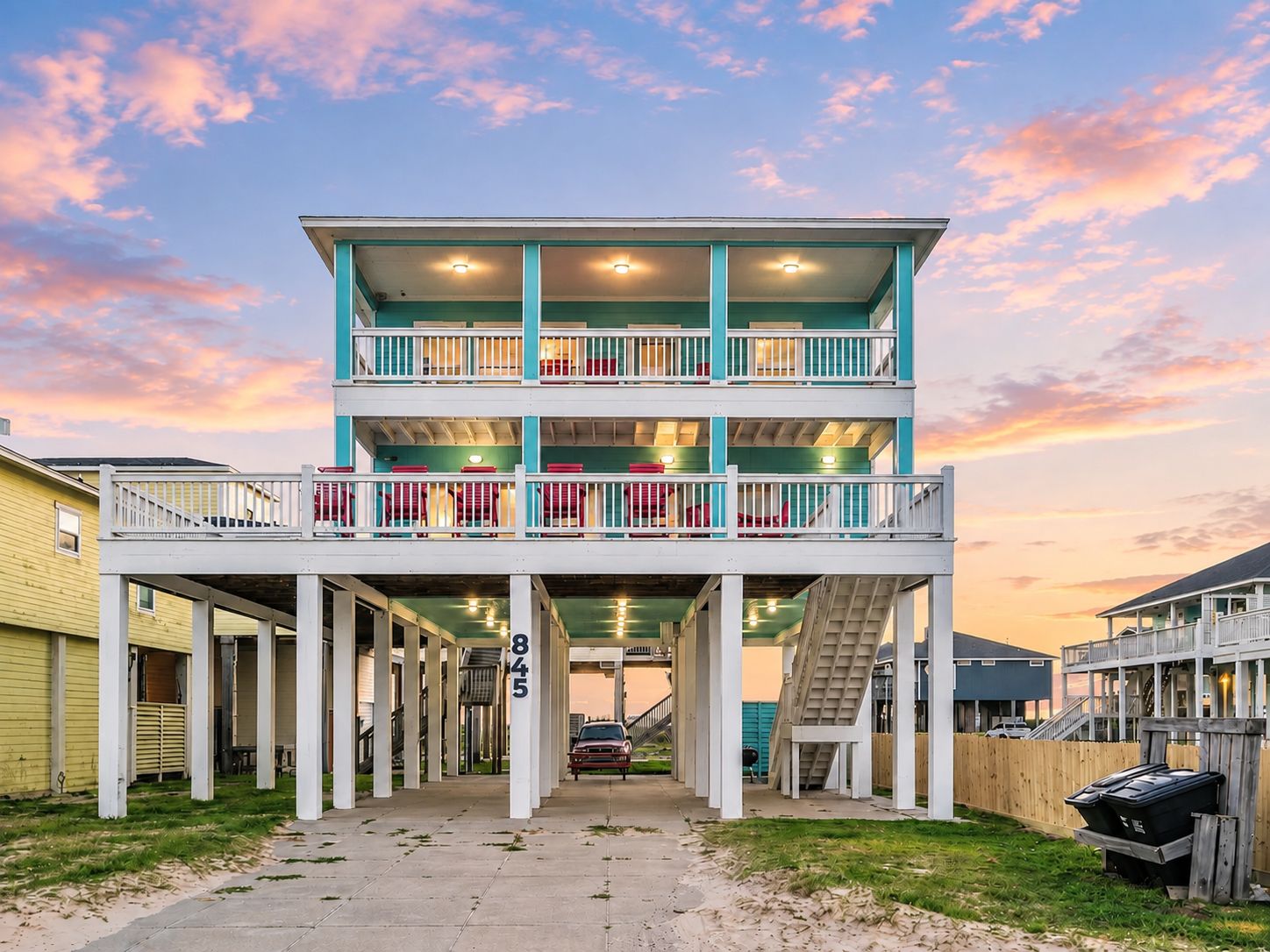 A multi-level building with a covered walkway, numbered 845, and a staircase leading to the upper levels.