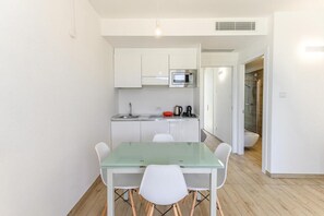 Apartment, 1 Bedroom, Balcony | Dining room - Stunning Capo Falcone Charming Apartments num 5089 (Stintino)