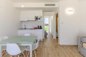 Apartment, 1 Bedroom, Balcony | Dining room - Stunning Capo Falcone Charming Apartments num 5089 (Stintino)
