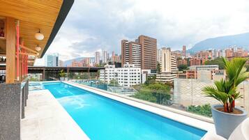 Outdoor pool, open 9:00 AM to 9:00 PM, pool umbrellas, sun loungers