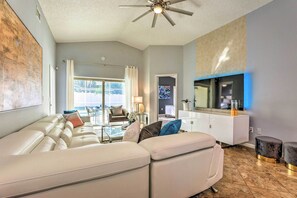 Relax in a comfortable seating area with a sleek sofa and storage cabinet.