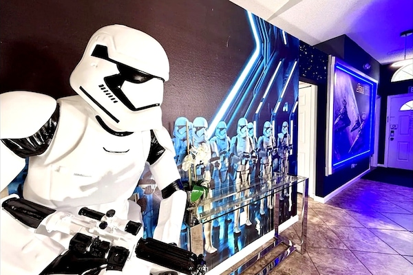 Welcome to Florida Disney Star Wars Villa - featuring a stormtrooper figure and themed wall art for a unique atmosphere.