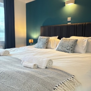 Premium bedding, Select Comfort beds, desk, laptop workspace