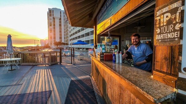 A bar with a sign that says 'Don't forget to tip your bartender.' - NEW! Terrace at Pelican Beach 0707 (Destin)