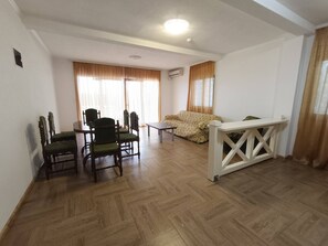 Apartment, 1 Bedroom, Smoking, Balcony | Living room - An Apartment in a Complex in a Pine Forest (Bar)