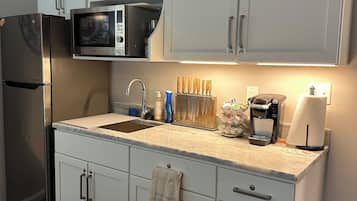 Fridge, microwave, coffee/tea maker, toaster