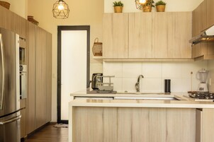 Casa Deluxe, patio, vistas al jardín | Cocina privada