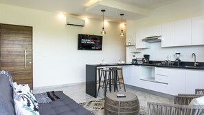 Appartement Confort, vue piscine | Coin séjour
