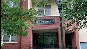 A building with a sign that reads "THE WASHINGTON" above the entrance.