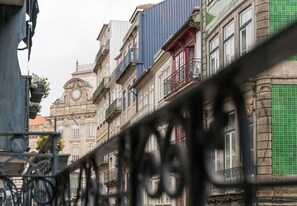 Stunning classical architecture with ornate balconies and a clock tower.
