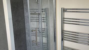 Shower, towels, toilet paper