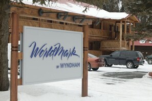 Wynham by Wyndham features a traditional wooden building with a charming entrance.