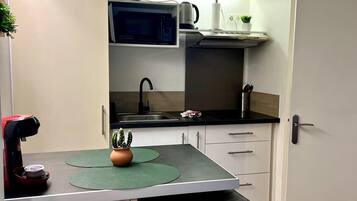 Fridge, microwave, coffee/tea maker, toaster