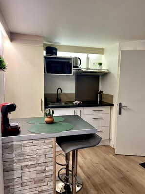 Fridge, microwave, coffee/tea maker, toaster