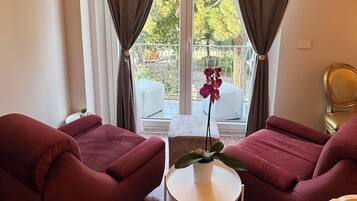 Luxury Double or Twin Room, 1 Bedroom, City View, Garden Area | Living area | 43-inch Smart TV with cable channels, pay movies