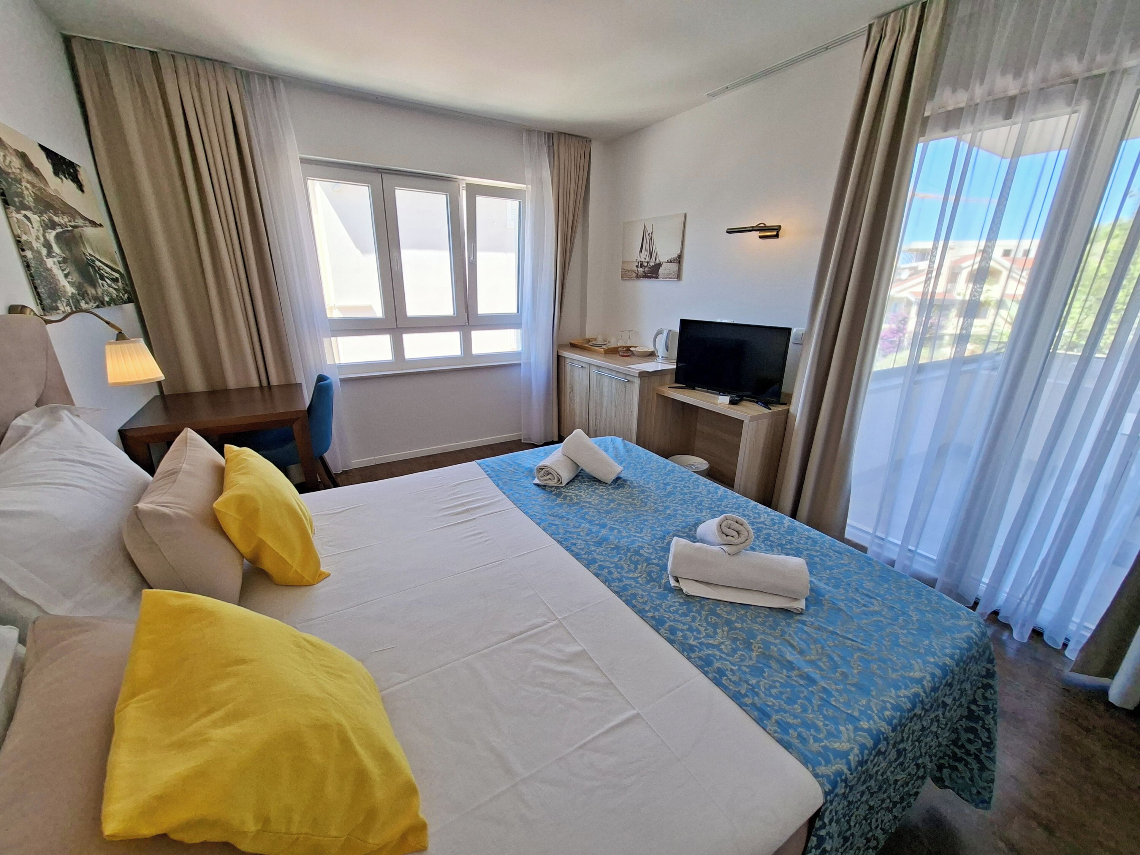 Standard Double Room, Balcony, Partial Sea View | In-room safe, desk, blackout drapes, free WiFi
