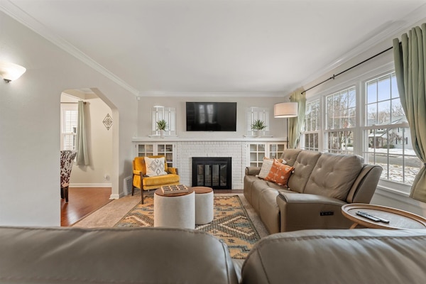 Cozy living room with lazyboy sofas and fireplace + TV