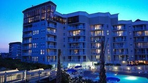 A multi-story hotel with balconies and a swimming pool. - Captain's Retreat-St. Regis Condo #2104 (North Topsail Beach)