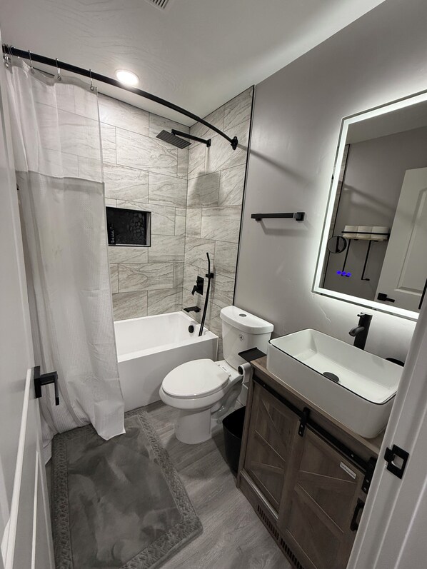 Shower, hair dryer, towels, soap