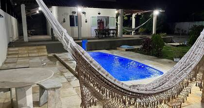 Airy house with swimming pool, 5 minutes from Farol beach. The perfect getaway!