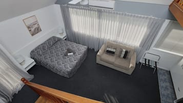 Executive Family Loft Suite | Living area | TV