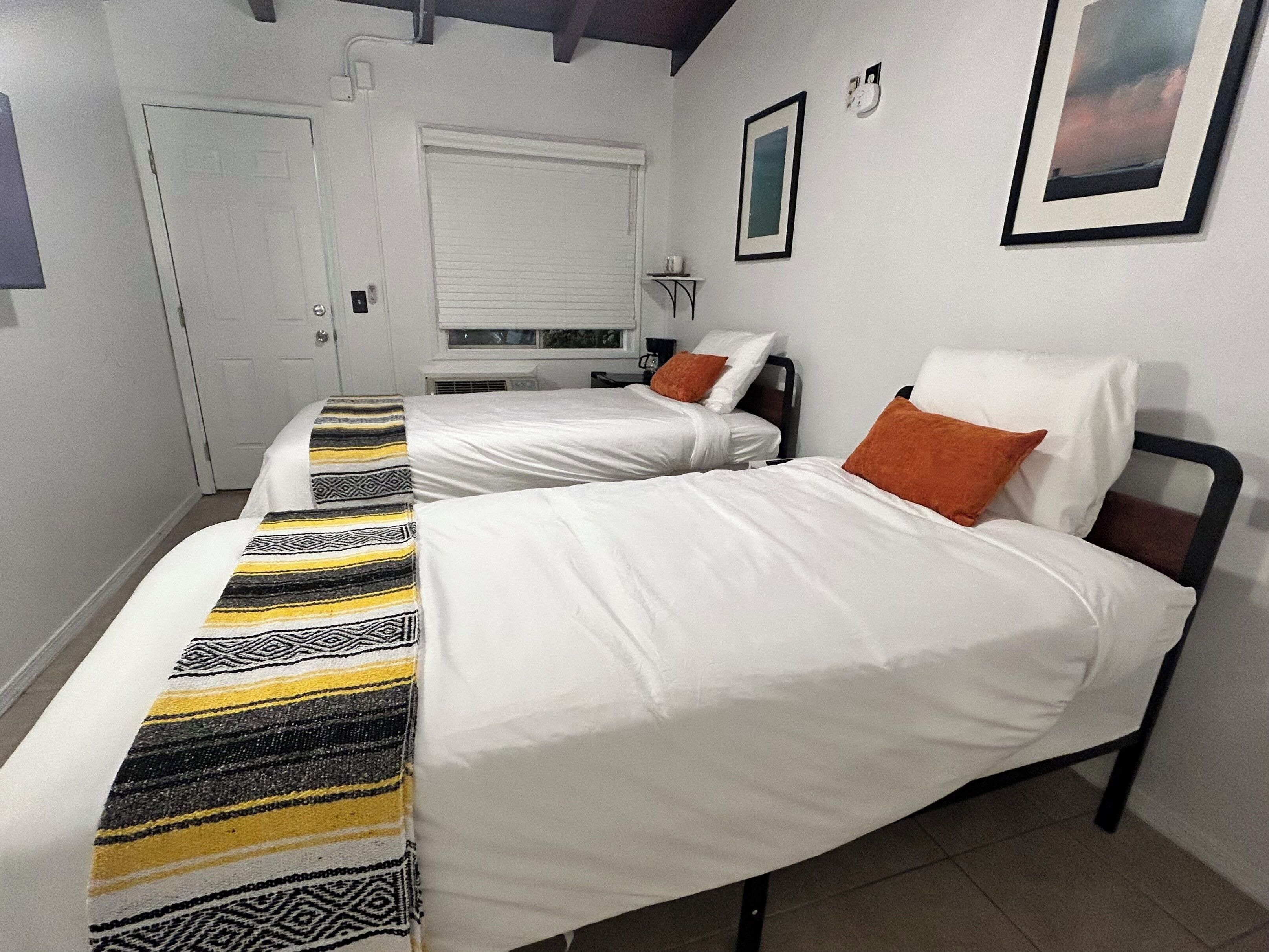 Twin Room | Down comforters, pillowtop beds, laptop workspace, free WiFi