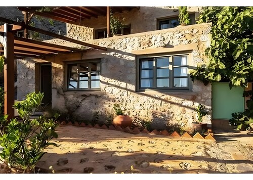 Maison de vacances 'Boutique Stone Cottage' avec vue sur la mer, Wi-Fi et climatisation