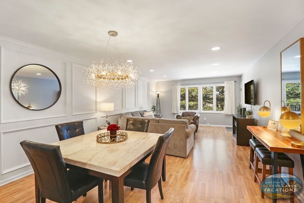 Open concept living and dining area. Comfortable den seating with smart TV, dining with seating for 4 people.