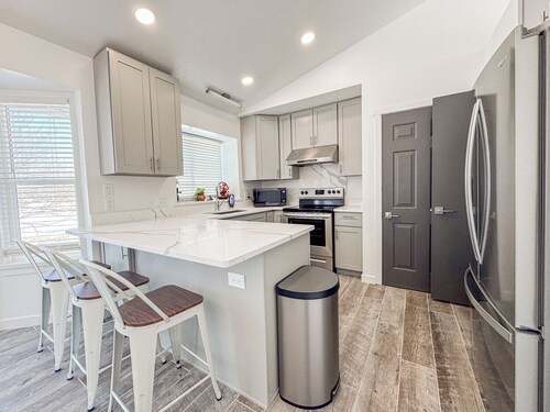 Spacious and conveniently located 5 Bedroom 3 Bath home in SLC with Amenities