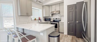 Spacious and conveniently located 5 Bedroom 3 Bath home in SLC with Amenities