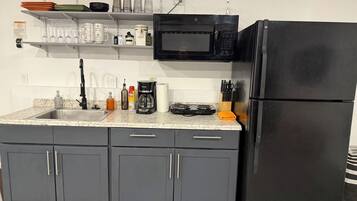 Fridge, microwave, stovetop, coffee/tea maker