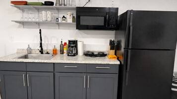 Fridge, microwave, stovetop, coffee/tea maker