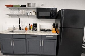 Fridge, microwave, stovetop, coffee/tea maker