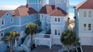 A coastal house with multiple levels, a balcony, and a view of the ocean. - Sea Glass - Huge Ocean Front Home with Gulf Views, Private Pool & Direct Beach Access (Miramar Beach)